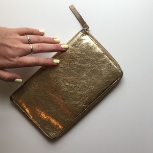 Gold Kate Spade oversized travel wallet