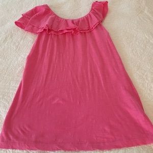 Lilly Pulitzer pink ruffled top.