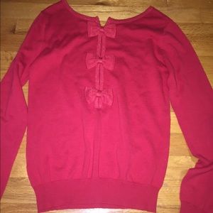 Cute sweater with bows on back