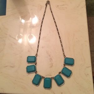 Silver necklace with teal.