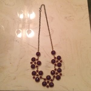 Gold necklace with purple