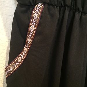 Black full length jumper with embroidered pockets