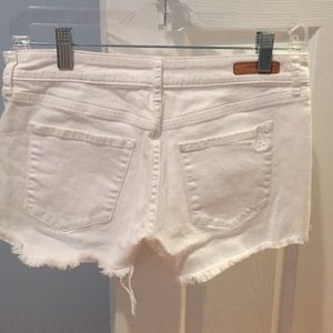 White denim fringe shorts
