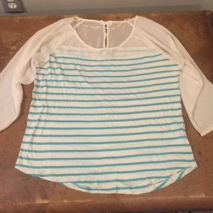 Turquoise blue and white stripped shirt.