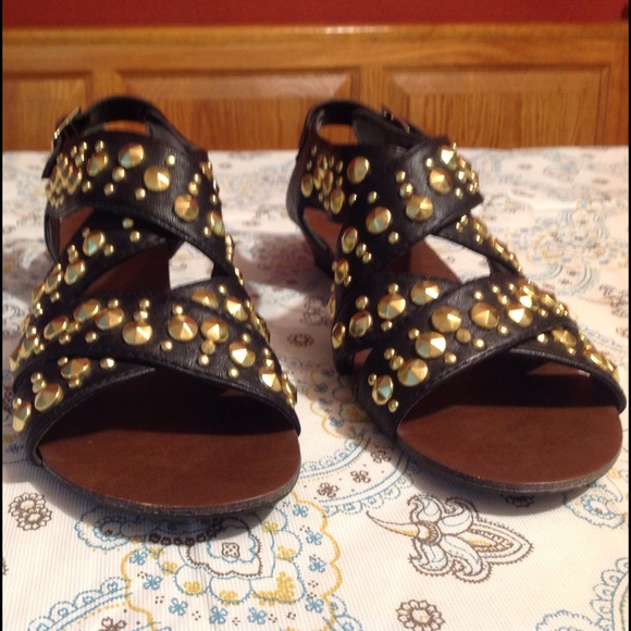 Black sandals with gold studs.