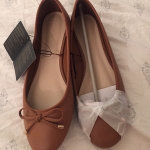 Brown bow tie flats