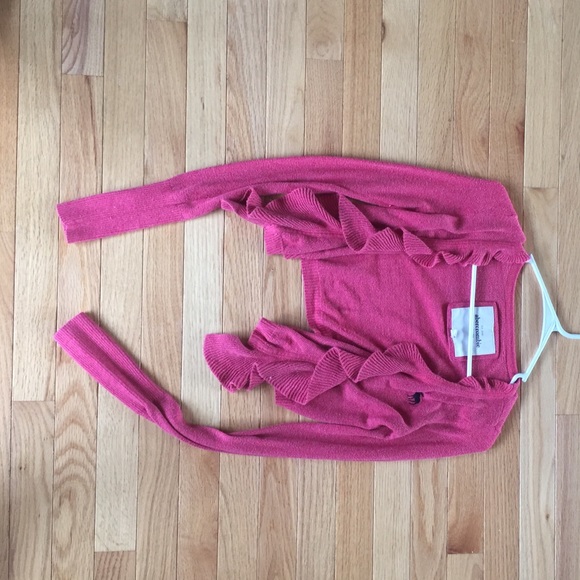 Pink cropped long sleeved cardigan