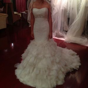 This is a brand new Winnie Couture wedding dress.