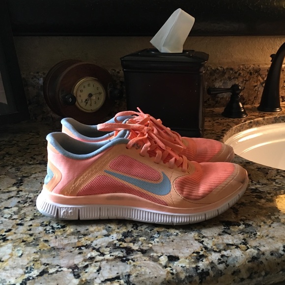 Bright orange Nike Free tennis shoes