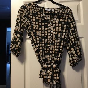 Beige and black New York & Company blouse.
