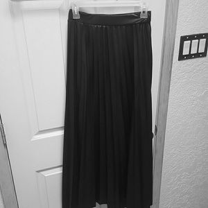 Floor-length black skirt.. leather look