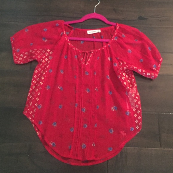 Sheer red blouse.
