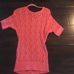 A bright pink top or mini dress, can be both.
