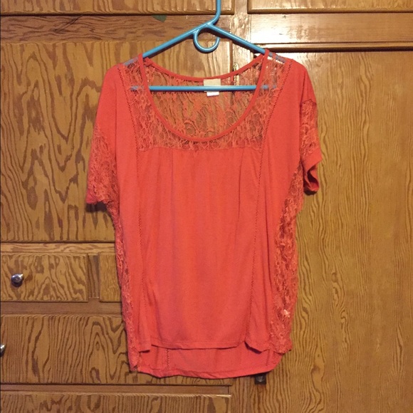 Daytrip top with lace accent.