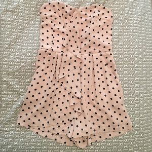 Ruffle front polka dot romper
