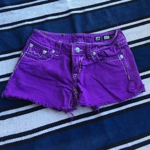 Purple jean shorts.
