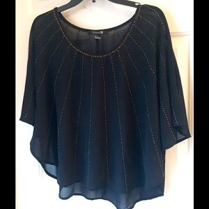 Sheer black top with gold details