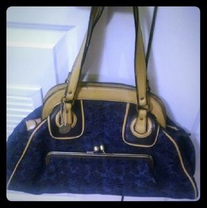 Blue jean purse trimmed in beige.