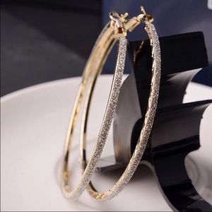 Round circle gold hoop earrings.