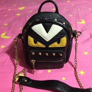 Little monsters cross body bag