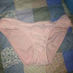 Peachy colored bathing suit bottoms