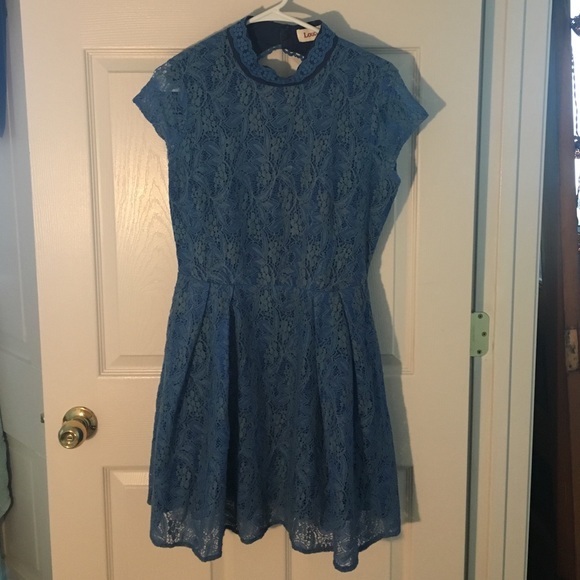 Key hole back lace blue dress with high neck.