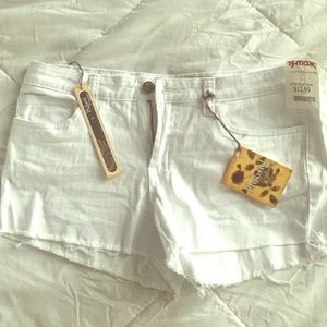NWT Stretchy white Jean cut off shorts (junior)