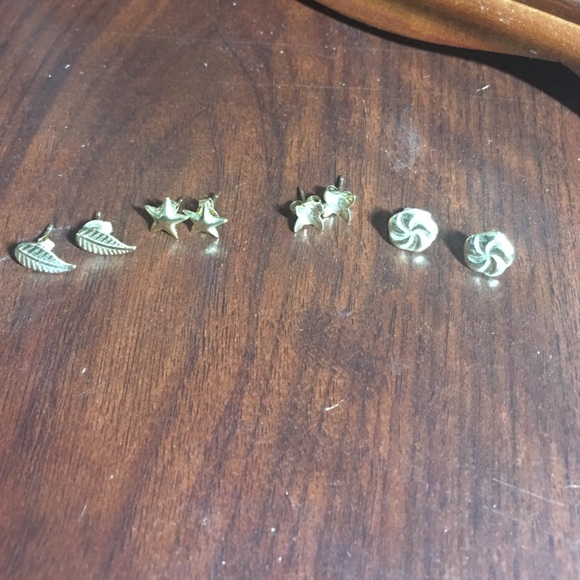 4 pairs of gold colored earrings