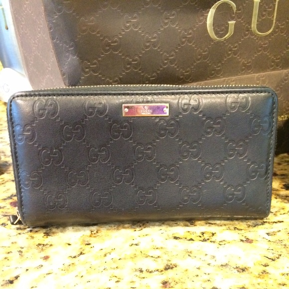 Sold to Maryann Black leather Gucci GG zip wallet