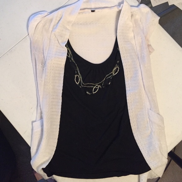 Black tank attached to white cardigan w/ necklace