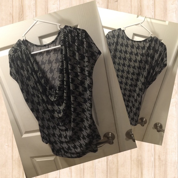 Houndstooth blouse with a swoop neck.