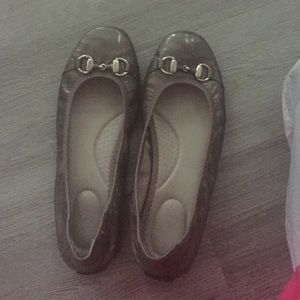 Patent grey ballet flats.