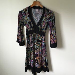 Black-trimmed, floral, peasant style dress.