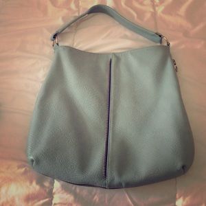 Purse with zipper on front and side.