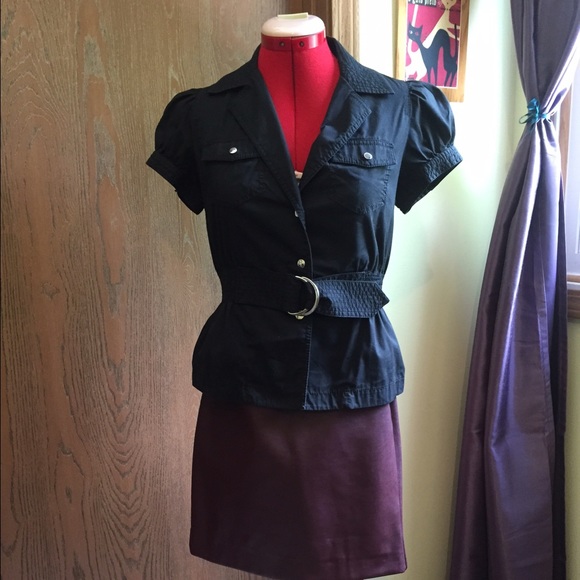 Black belted top with double breast pockets.