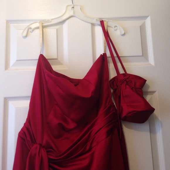 Formal apple red gown with matching bag.