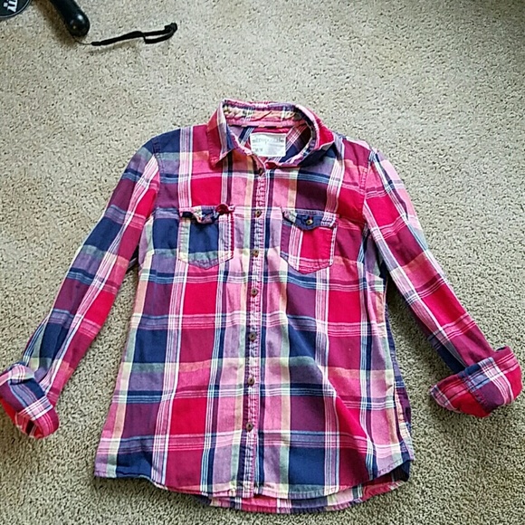 pink, blue, and red button up flannel