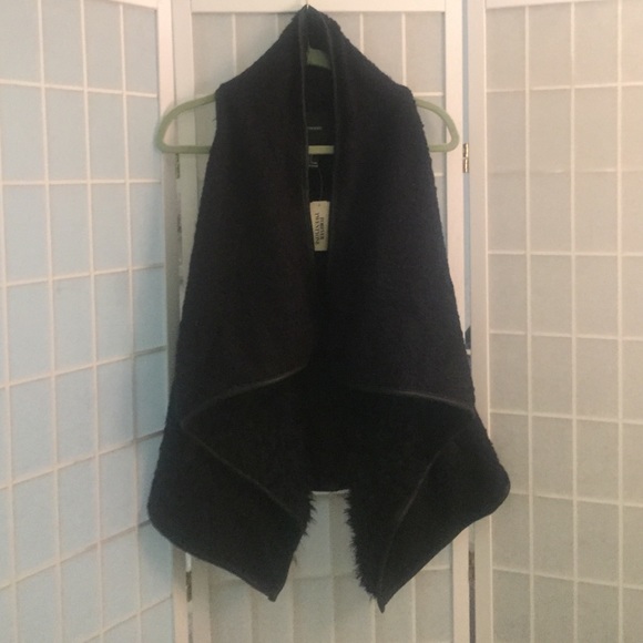 Black fuzzy/furry vest. Size L.