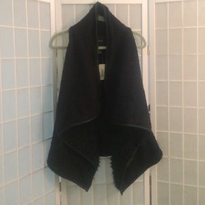 Black fuzzy/furry vest. Size L.