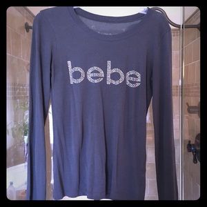 Gray long sleeve top - says "bebe"