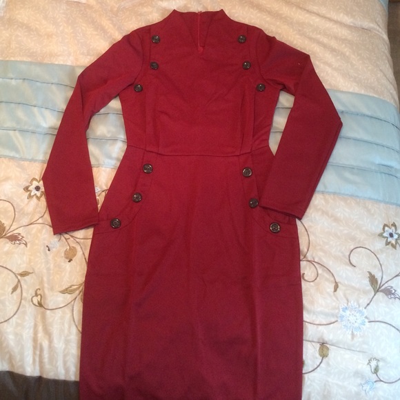 Form fitting claret red dress.
