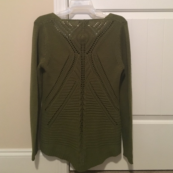A knitted olive green sweater.