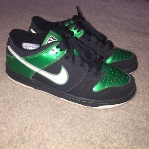 Black, green, and white nikes.