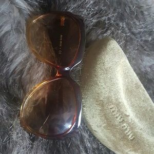 Miu Miu sunglasses with case.