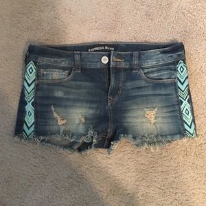 Denim shorts with Aztec design on side