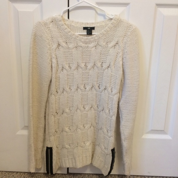 Cream sweater with black zipper detailing
