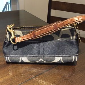 denim color blue with dark brown strap.