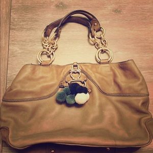 Juicy Couture genuine leather purse with poms