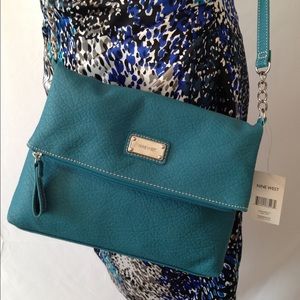 New cute teal cross body purse.