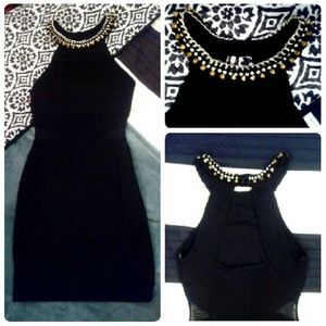 Black dress with metallic detailed collar.